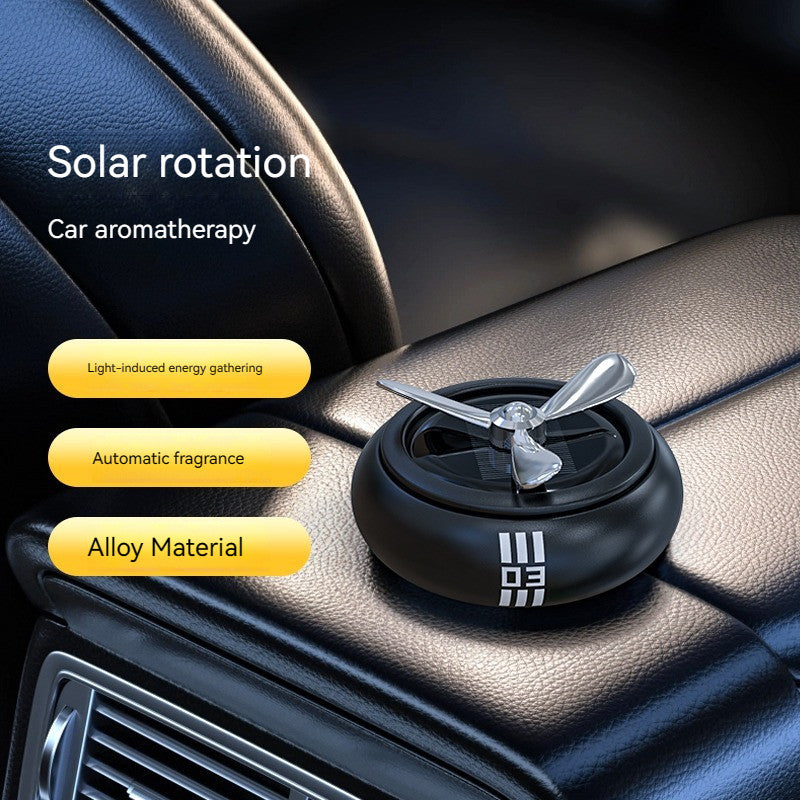 Solar powered car mounted rotating aromatherapy device
